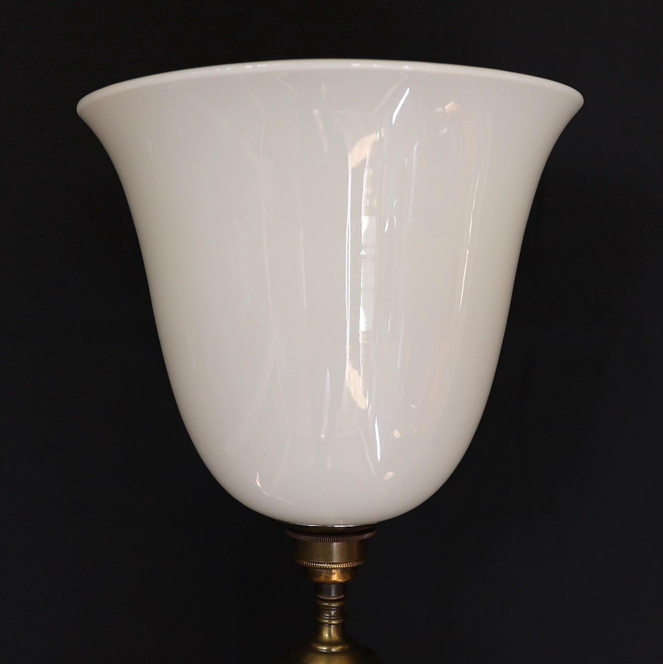 A 1950’s oxidised brass column table lamp with opaque white glass uplighter shade, height overall 84cm